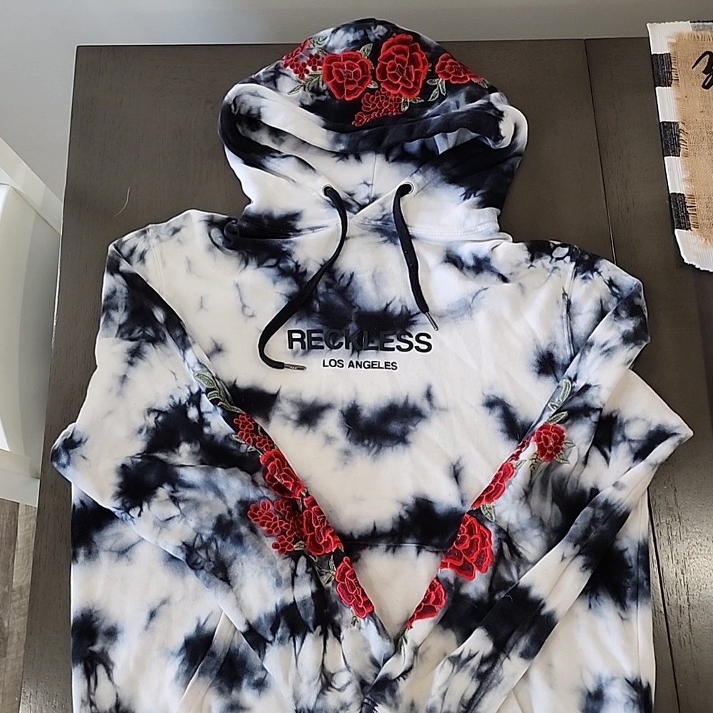 Young and reckless hoodie with rose decal.